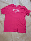 Pink t-shirt with 'RODEO' and a bull skull design on a beige surface
