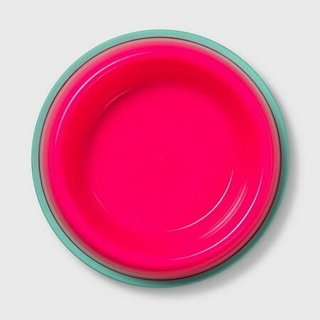 Pink bowl with green rim on a light gray background