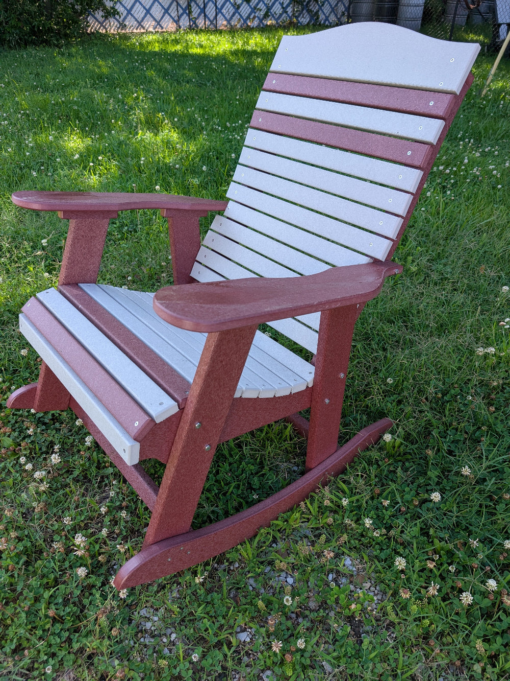 Cherry and light gray poly rocker on front porch in natural light