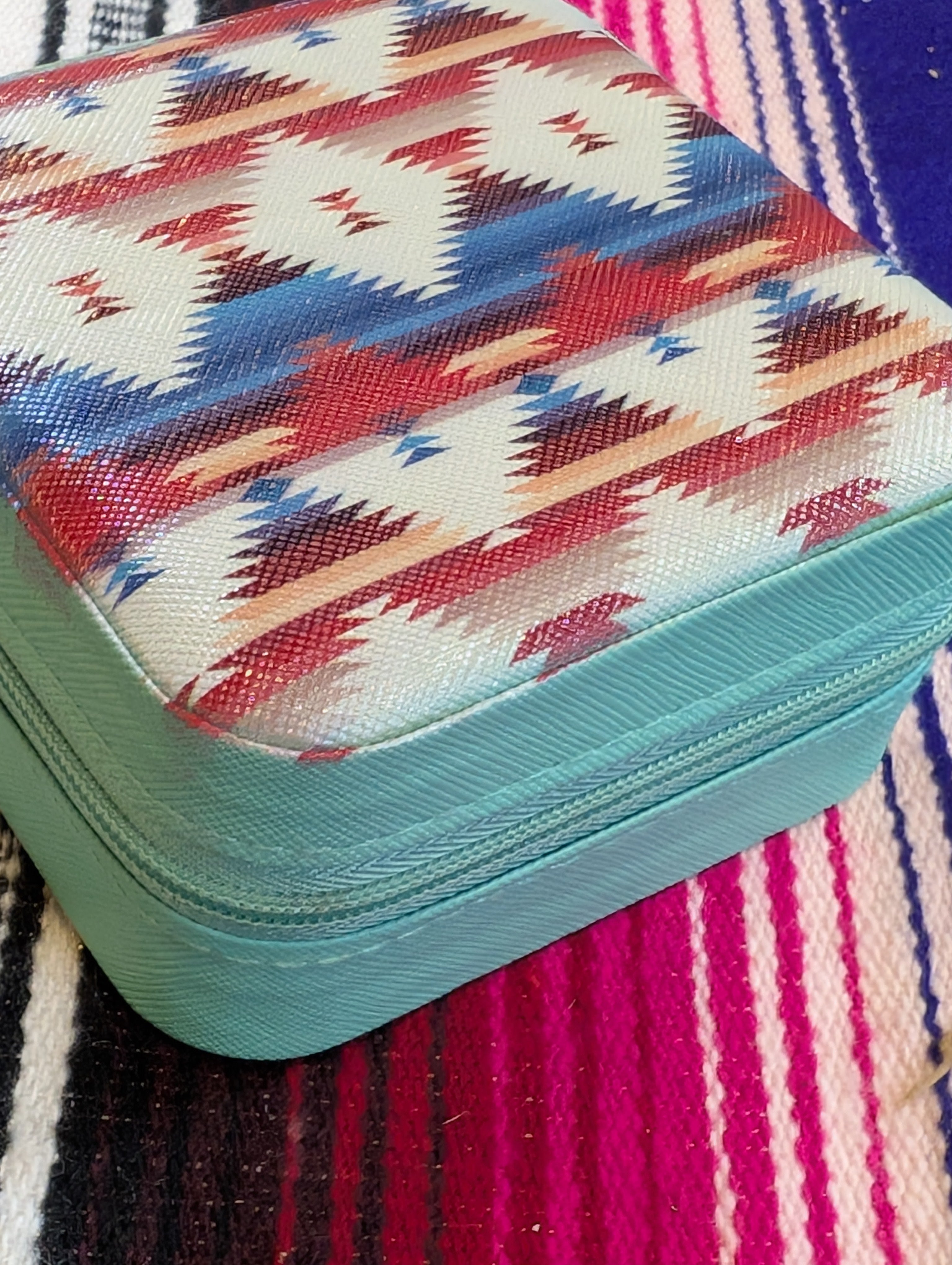 Compact travel jewelry organizer with rustic design and secure zipper