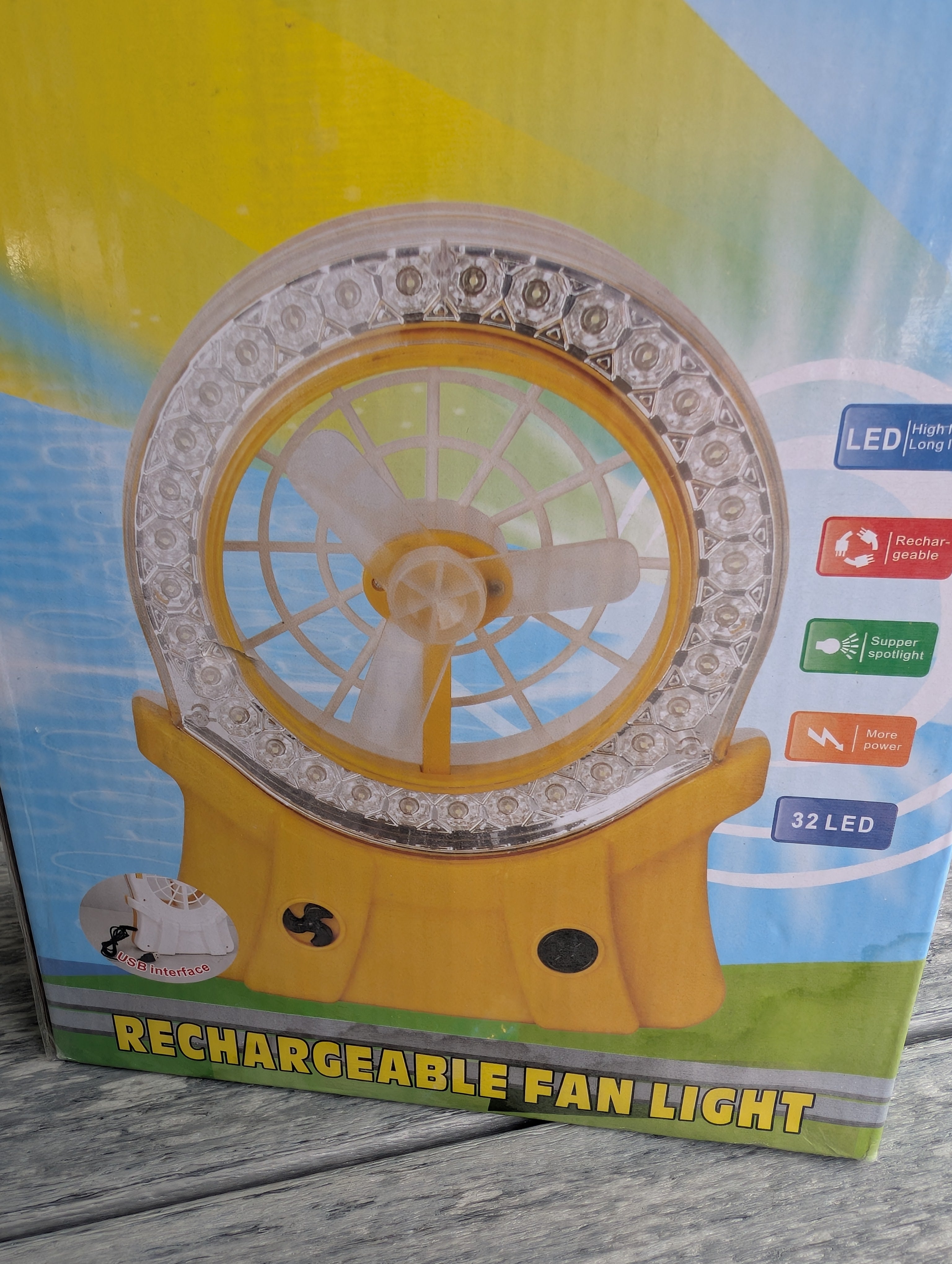 Rechargeable fan with LED ring light shown on table
