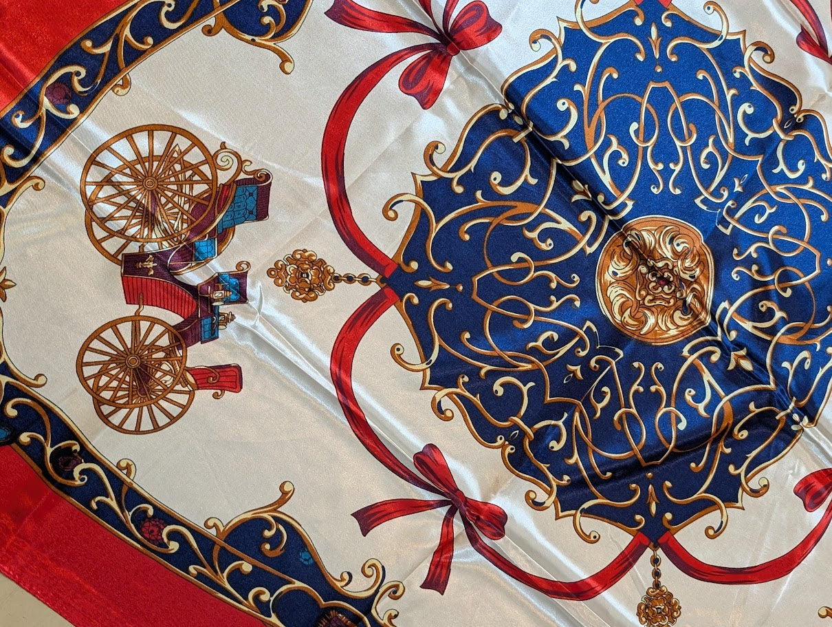 close up of a Red scarf/wild rag with bows & wagon