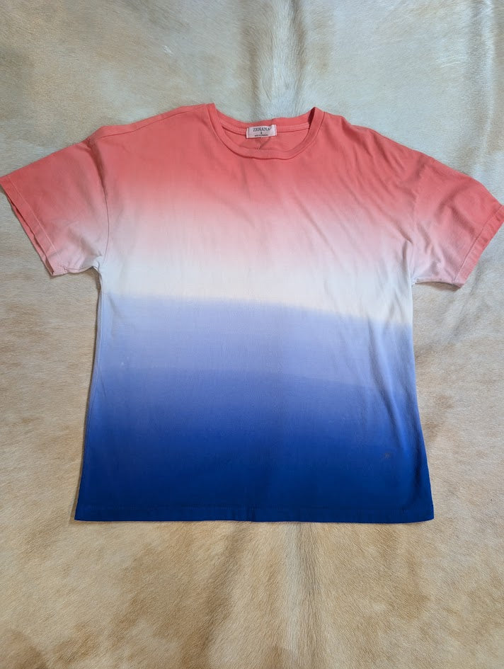 Dip dye red, white, blue t-shirt with a beige background. 