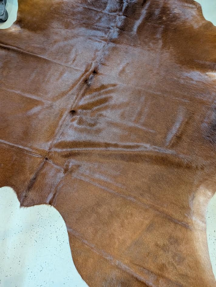 Closeup of a Reddish/Brown cowhide rug 
