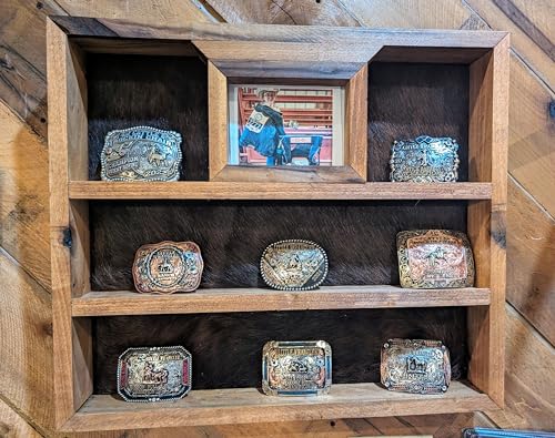 Large handcrafted trophy buckle display in dark walnut finish with cowhide backing, photo frame, and shelves for up to 10 belt buckles