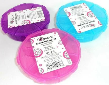 Three round plastic organizers in purple, pink, and blue with labels on a white background.