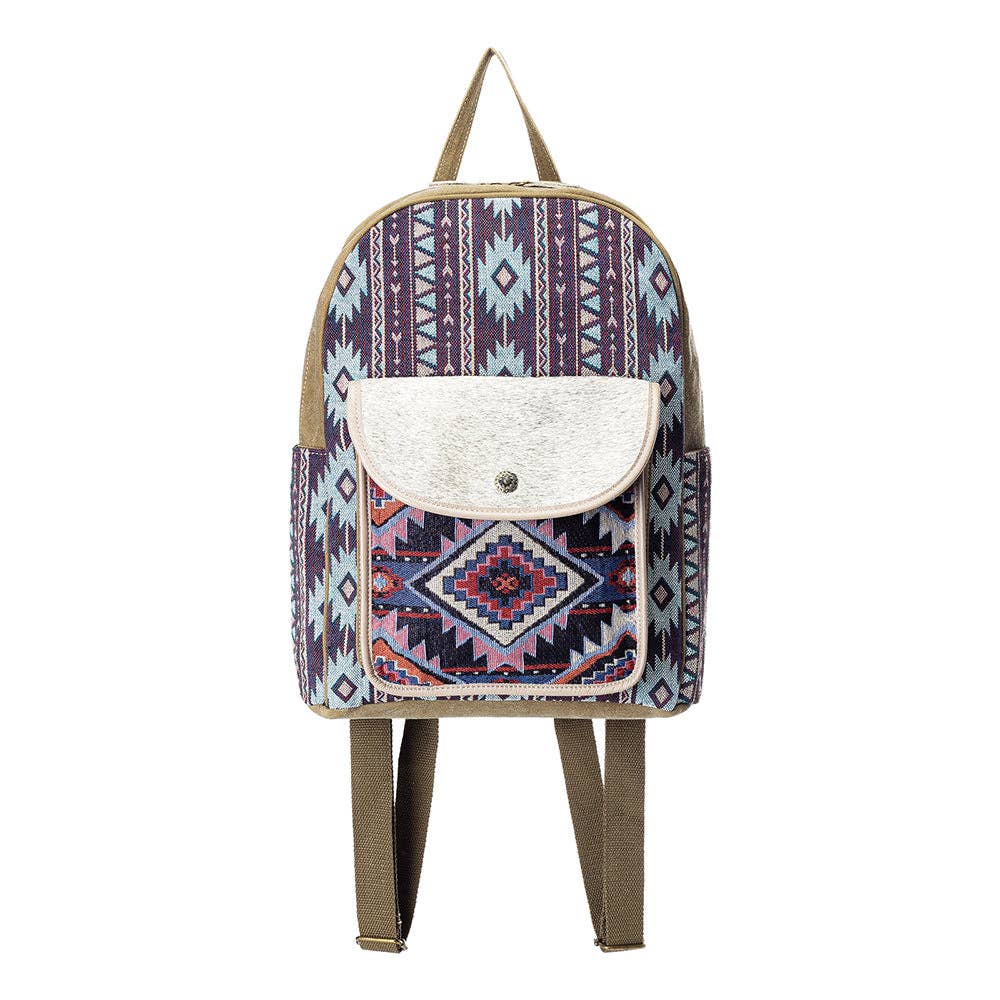 Backpack with tribal pattern and hair on flap on a white background