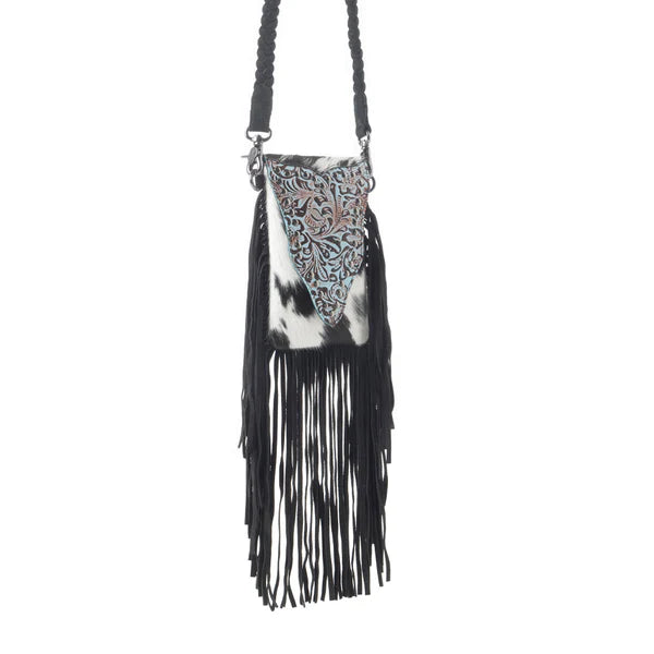 Black and white patterned bag with fringes on a white background