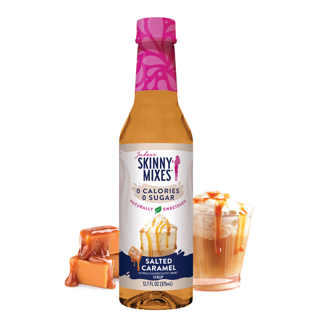 A bottle of Naturally Sweetened Salted Caramel Syrup with a pink cap, labeled 'Skinny Mixes'. The label also features an image of caramel and a prepared beverage.