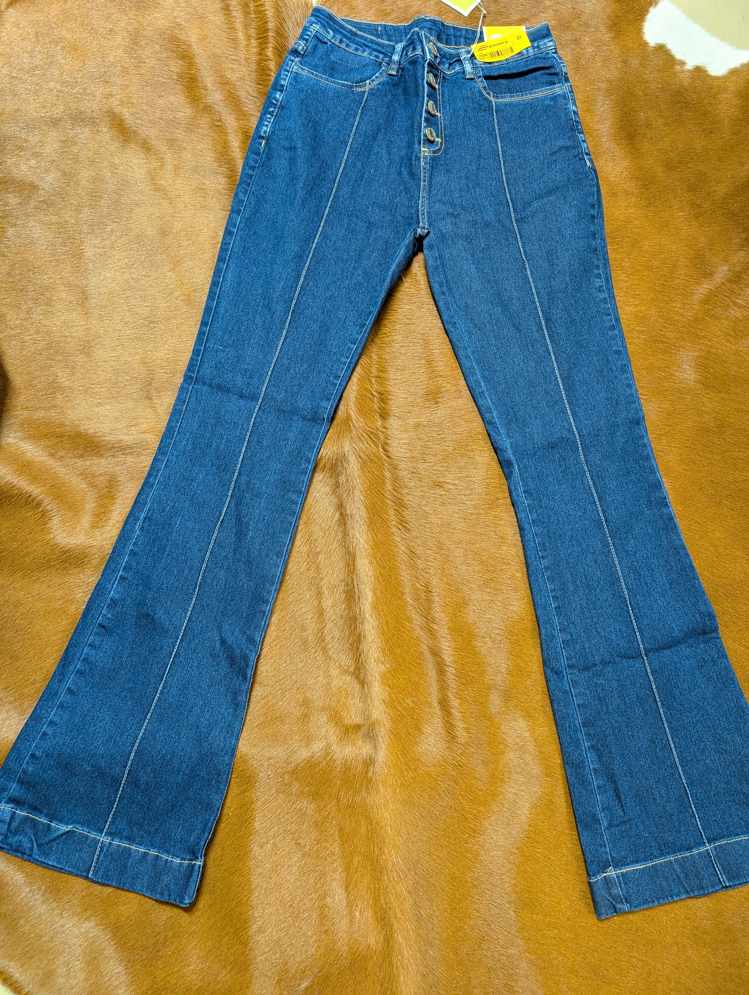 Sawary flare leg jeans with a brown background.