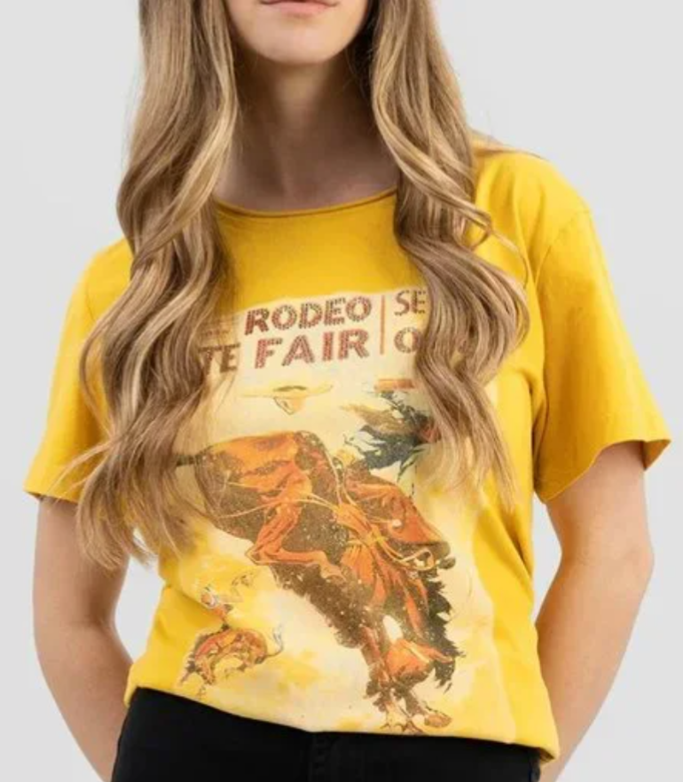 Western Rodeo State Fair yellow graphic tee by American Bling featuring rodeo scene, shown on model

