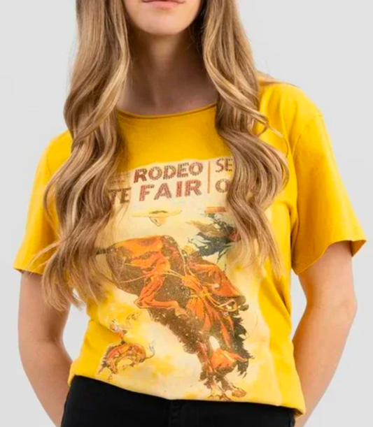 Western Rodeo State Fair yellow graphic tee by American Bling featuring rodeo scene, shown on model

