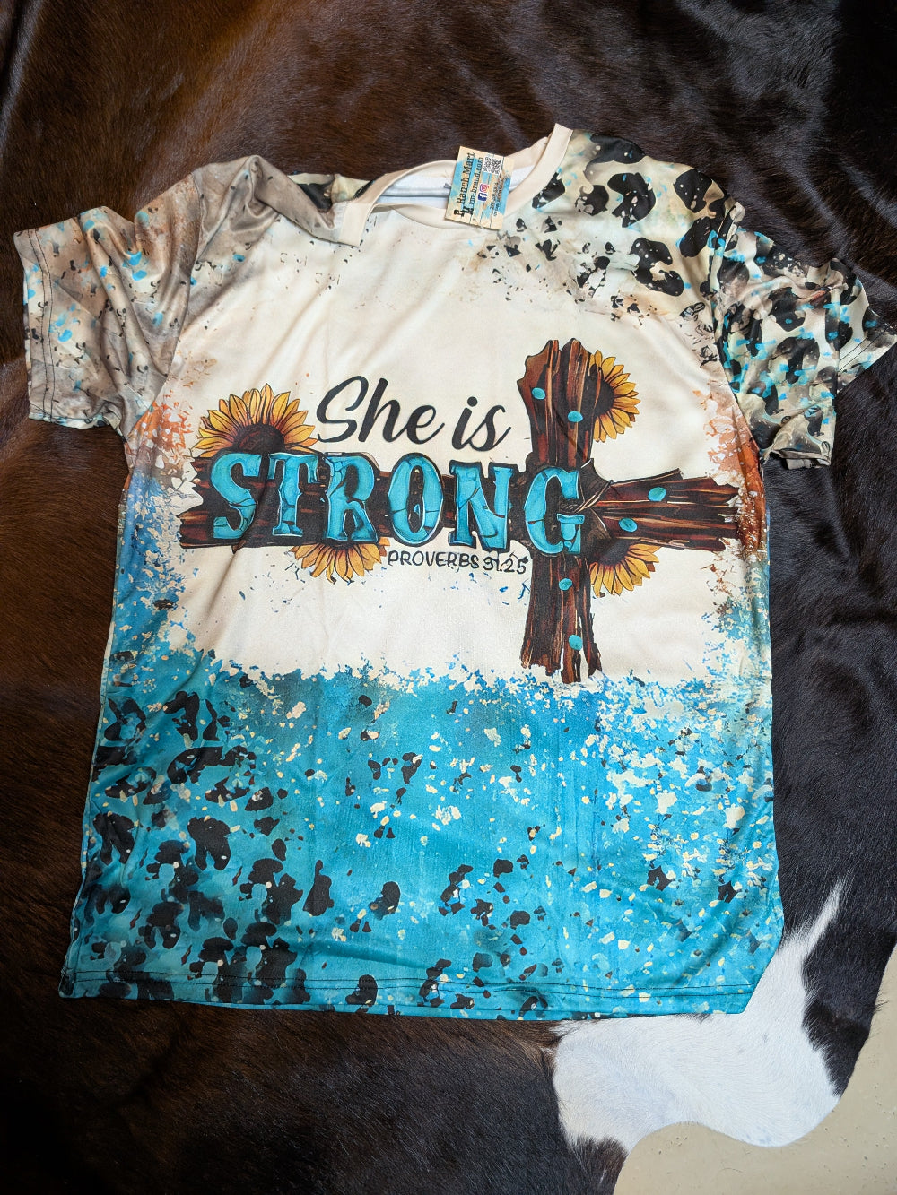 Plus-size graphic shirt in XXL with 'She is Strong' text design"