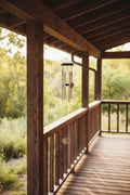 Decorative wind chime hanging on porch