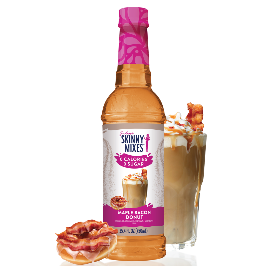 Bottle of Skinny Mixes Maple Bacon Donut syrup with a glass of coffee and donut on a white background