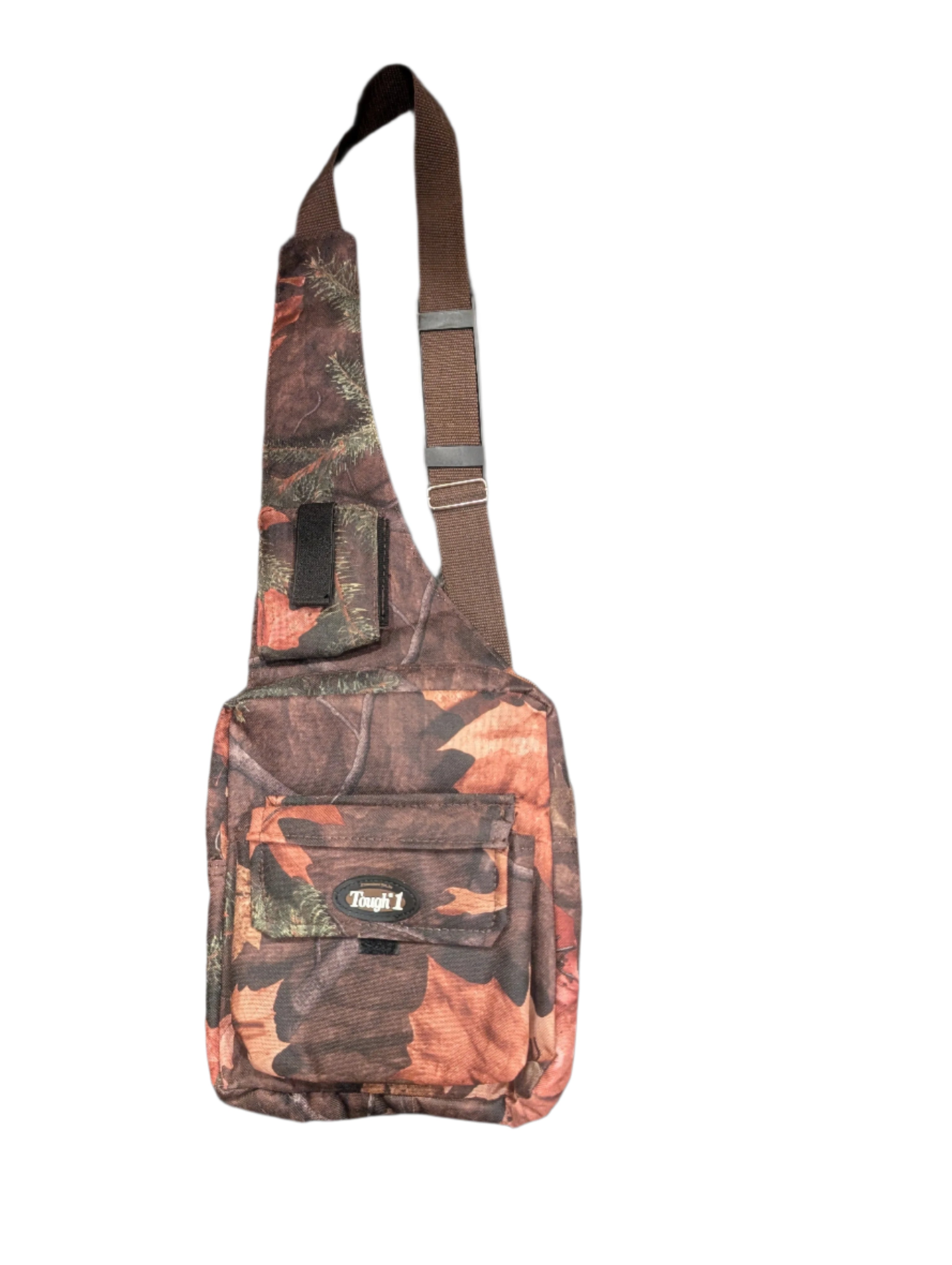 Compact camo sling bag with front pouch and padded interior, ideal for hiking or carrying a small tablet.