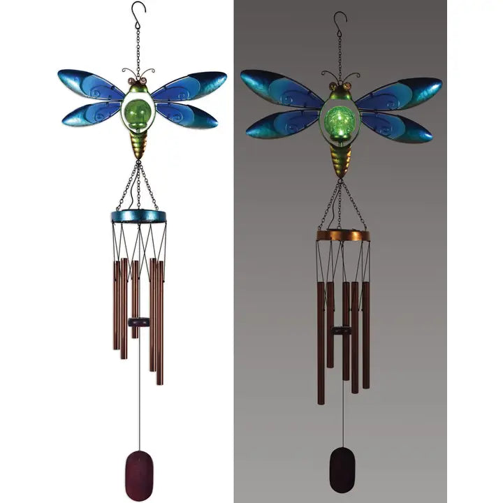 Dragonfly-shaped wind chime with metallic finish shown in day and night