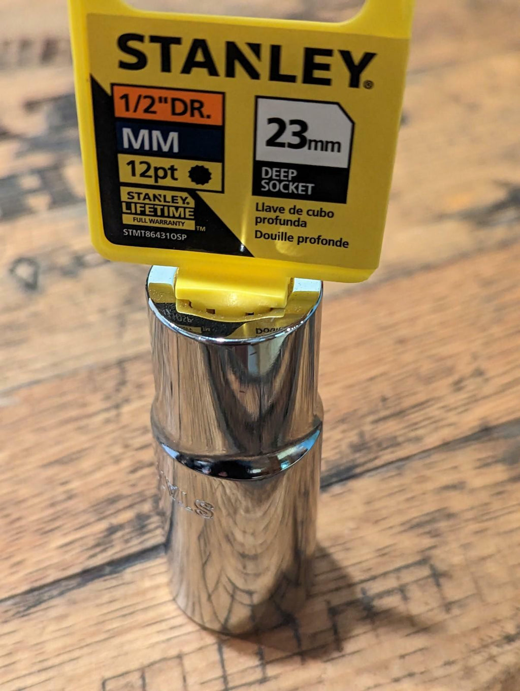 Stanley deep socket on a wooden surface with a clear label