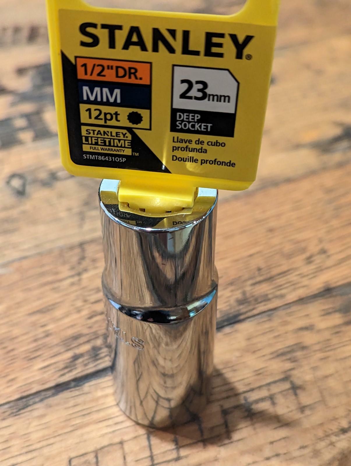 Stanley deep socket on a wooden surface with a clear label