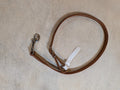 Brown leather tie down strap with a snap on a white surface