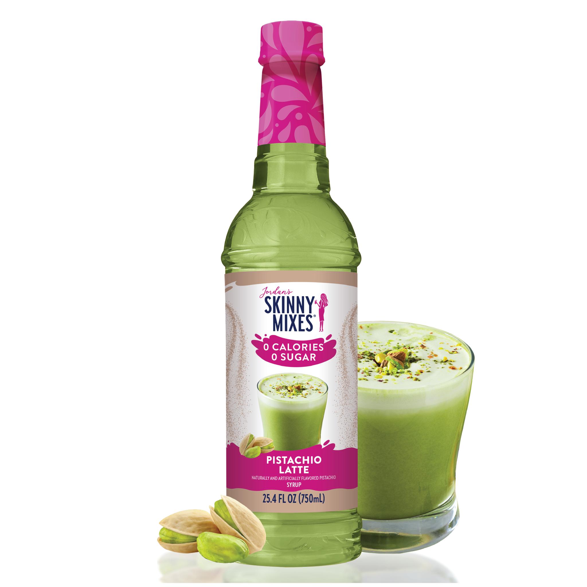 A bottle of Sugar Free Pistachio Syrup by Skinny Mix with a glass of pistachio latte in the background, alongside some pistachio nuts.
