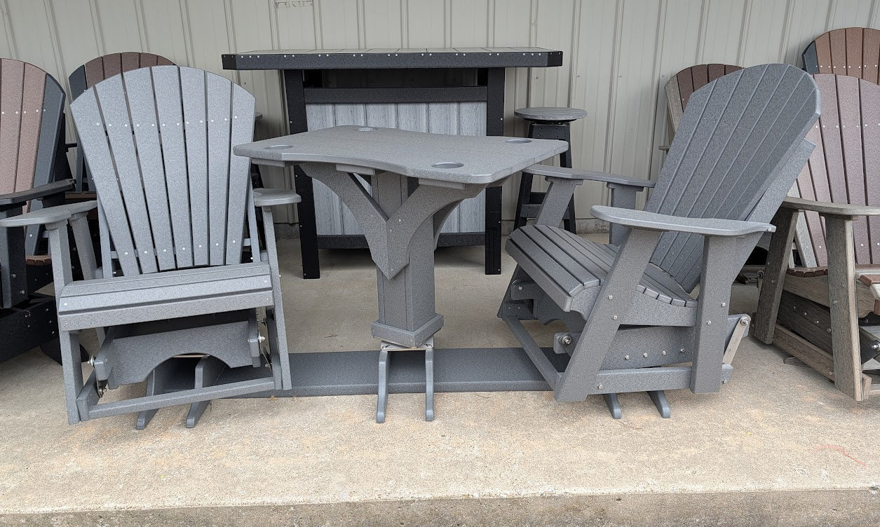 Outdoor furniture set with gray chairs and table on a porch.