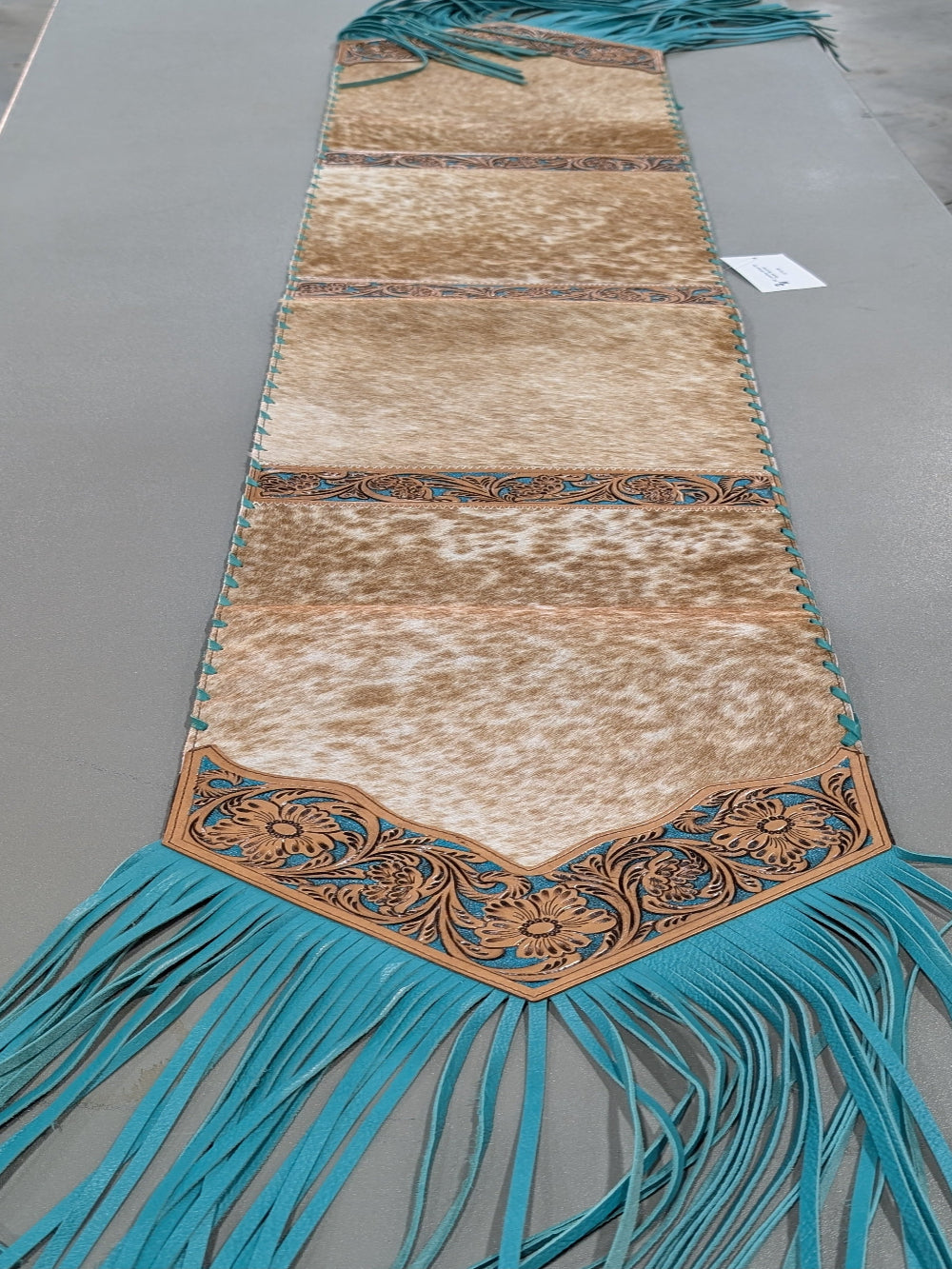6ft genuine cowhide leather table runner with teal fringe and tooled leather ends