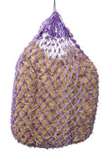 A large hay net with an open structure, featuring poly hay cord and purple rope, designed to slow feed hay to horses.