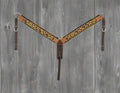 Brown leather bridle with decorative pattern on a white background