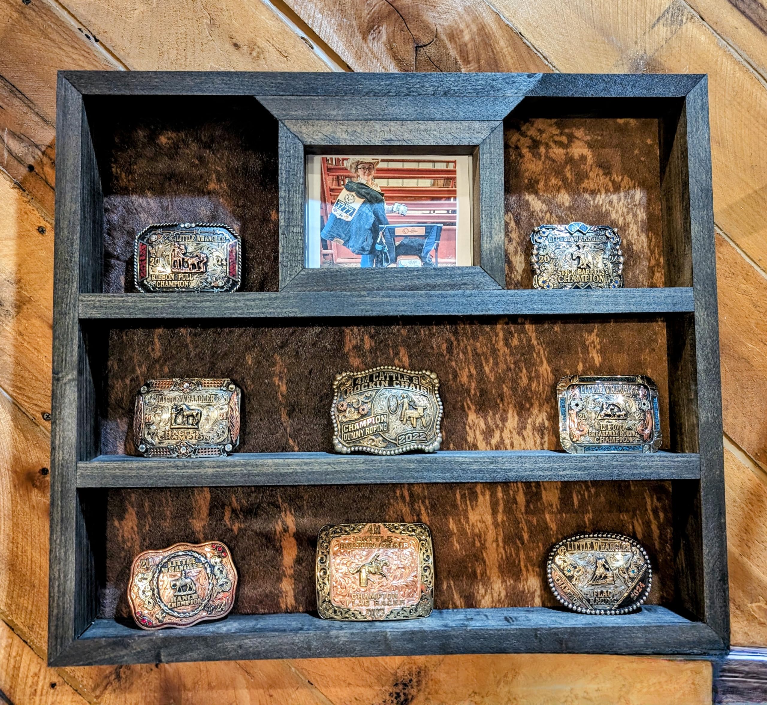 Large handcrafted trophy buckle display in dark walnut finish with cowhide backing