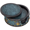 A set of round resin coasters with a turquoise snake skin texture and gold dot and cross accents, displayed with a matching stand.