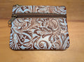 Patterned pouch with a zipper on a wooden surface