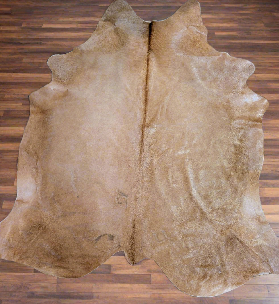 Genuine blonde cowhide with natural branding marks and rustic texture