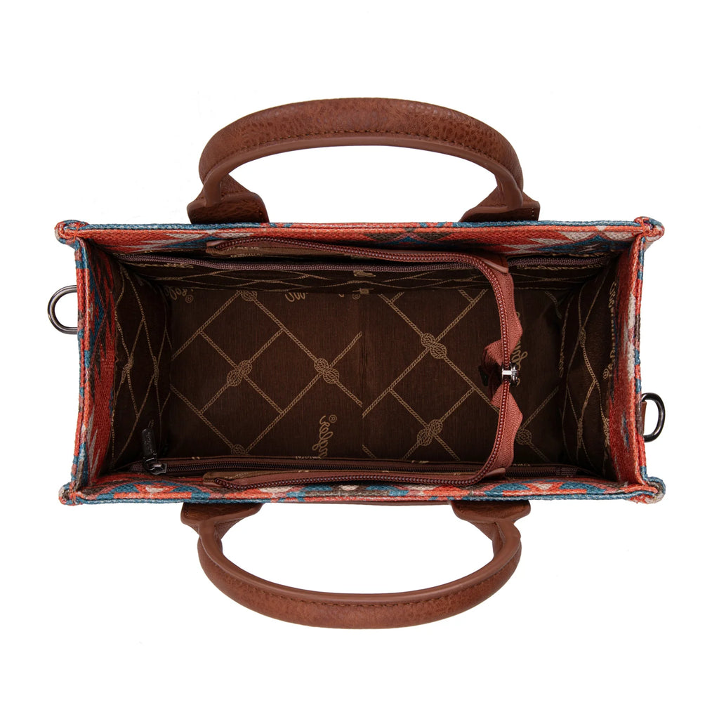 Brown leather handbag with a textured interior on a white background