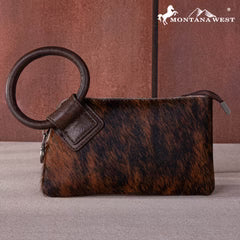 Brown leather handbag with a keyring on a gray surface, featuring the Montana West logo.