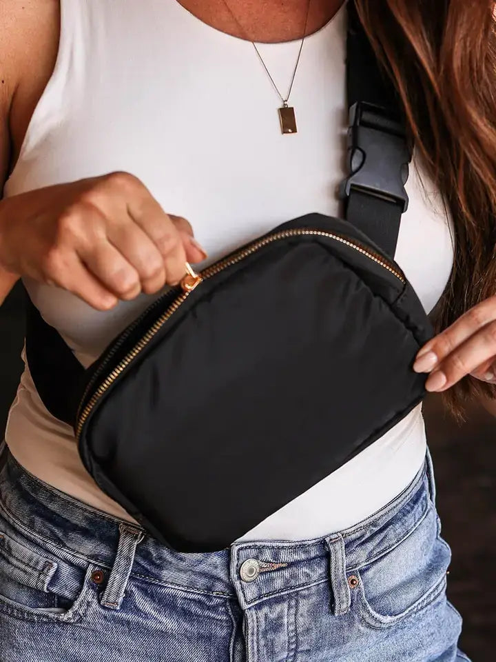 Waterproof Crossbody Chest Bag on a lady wearing a white shirt and blue jeans