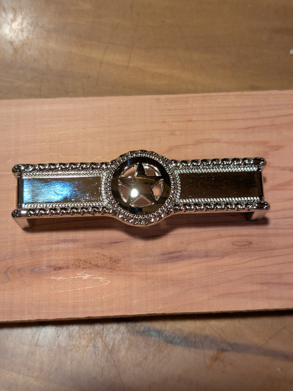 Metal western drawer handle featuring star motif, ideal for farmhouse cabinets and bedroom furniture.


