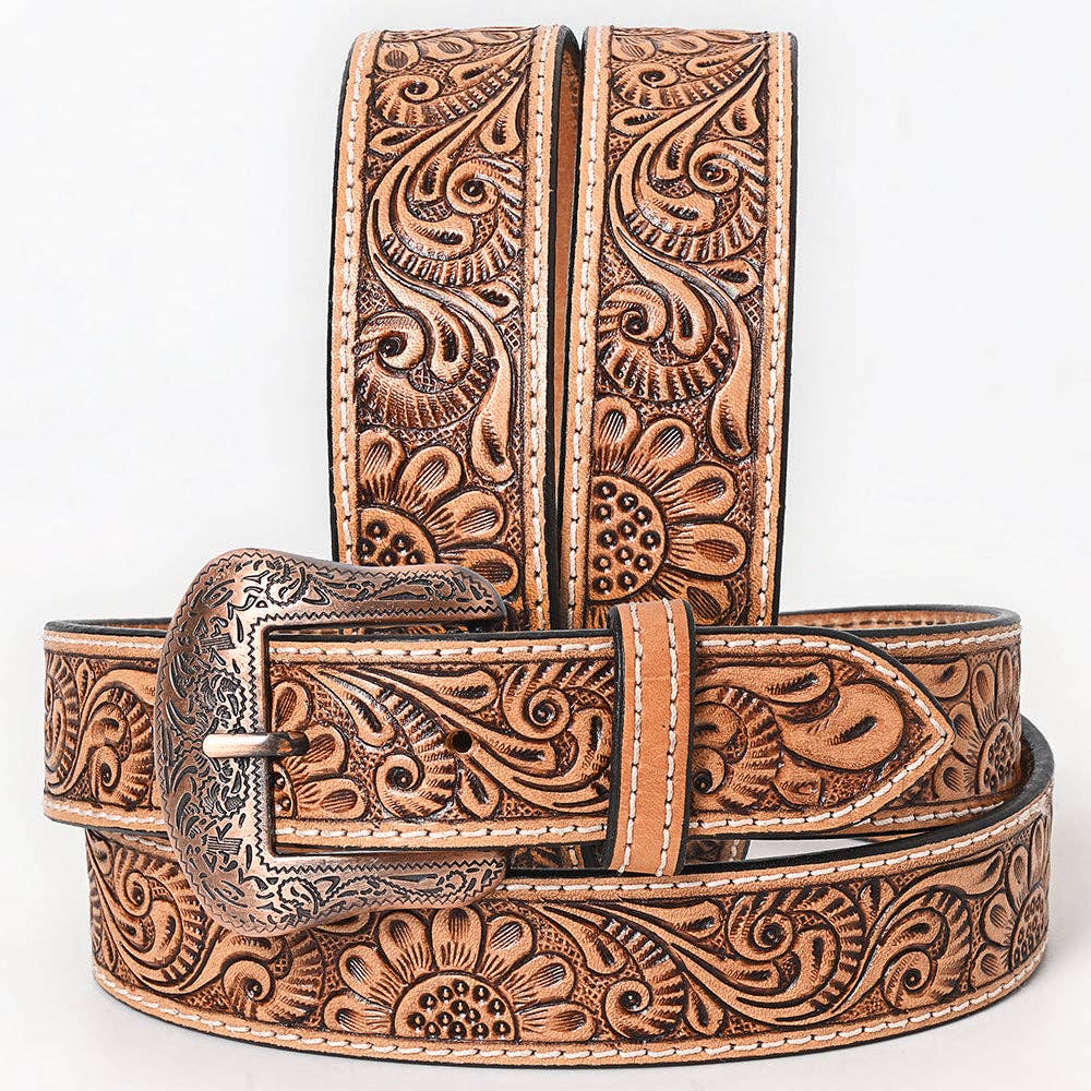 Brown leather belt with intricate floral patterns on a white background