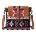 Patterned shoulder bag with brown leather accents on a white background
