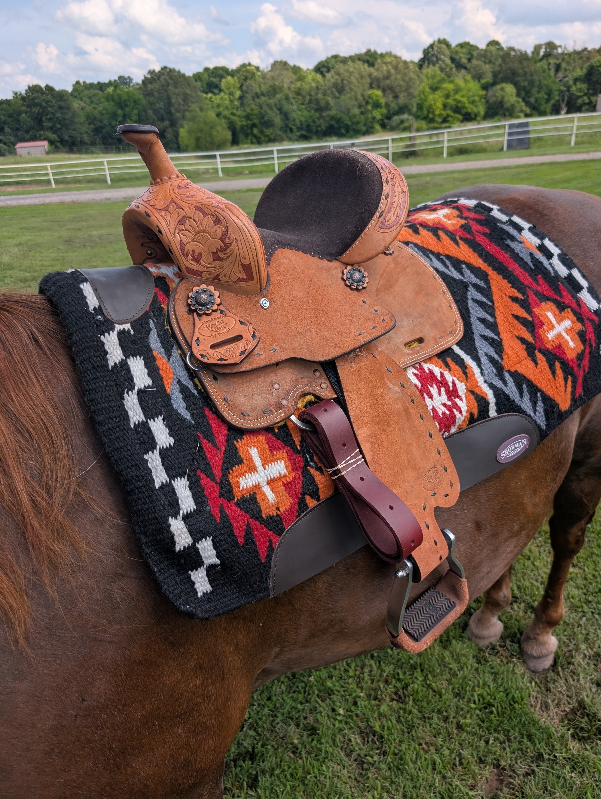 Western kids' barrel racing saddle with chocolate buckstitch and antiqued copper conchos