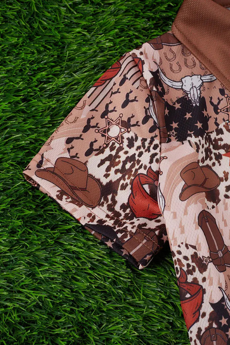 Close-up of horse printed fabric on kid’s cowboy shirt