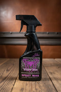 Widow Wax Instant Spray Wax 16 oz black spray bottle on a rustic wooden background.