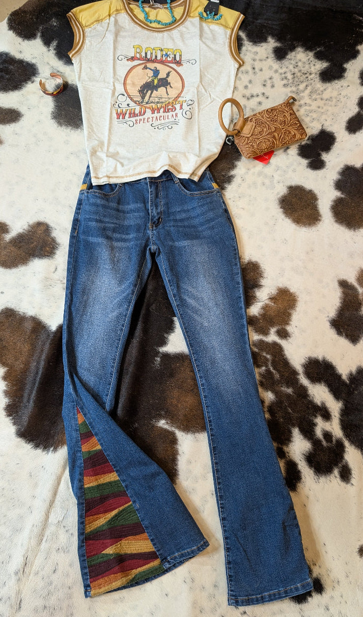 Delila women’s mineral wash Wild West graphic tee in grey tones, displayed flat on cowhide rug

