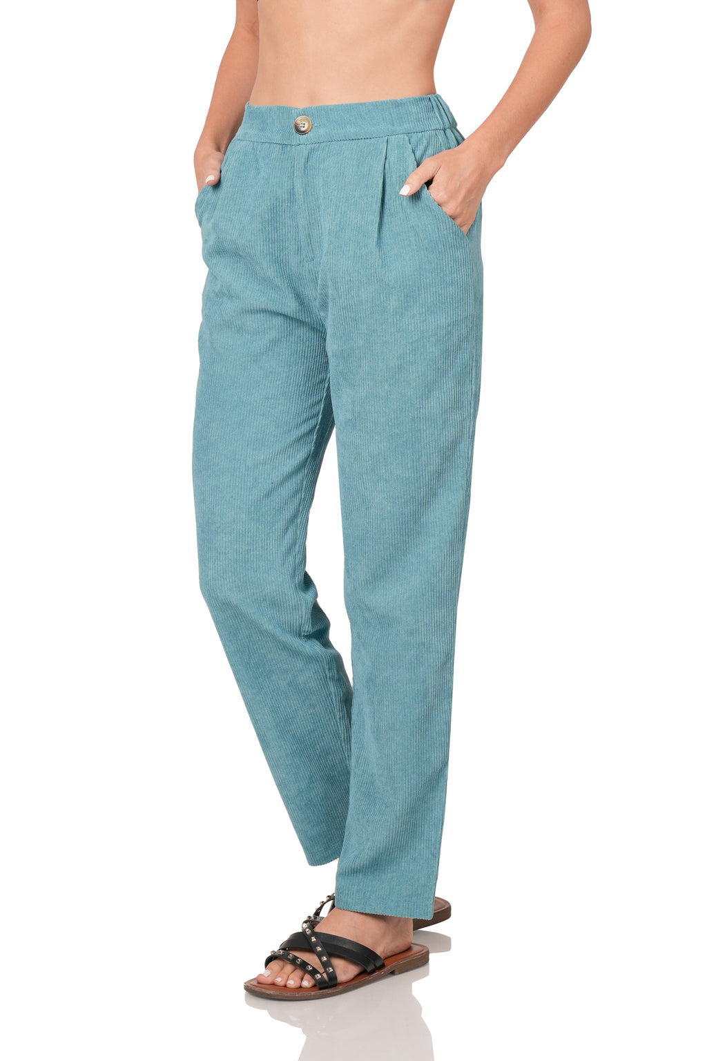 Teal pants worn by a person on a white background