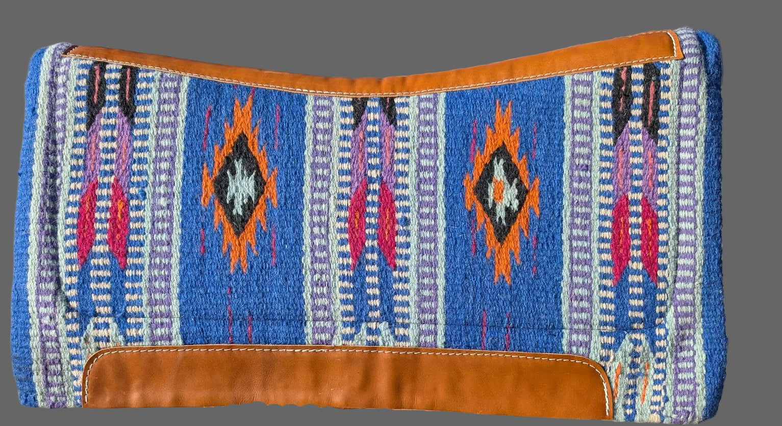 Blue Aztec Memory foam Saddle Pad with gray background

