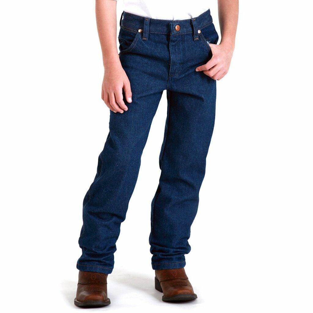 Wrangler Boys' Cowboy Cut Jean's Regular fit on a boy wearing brown boots