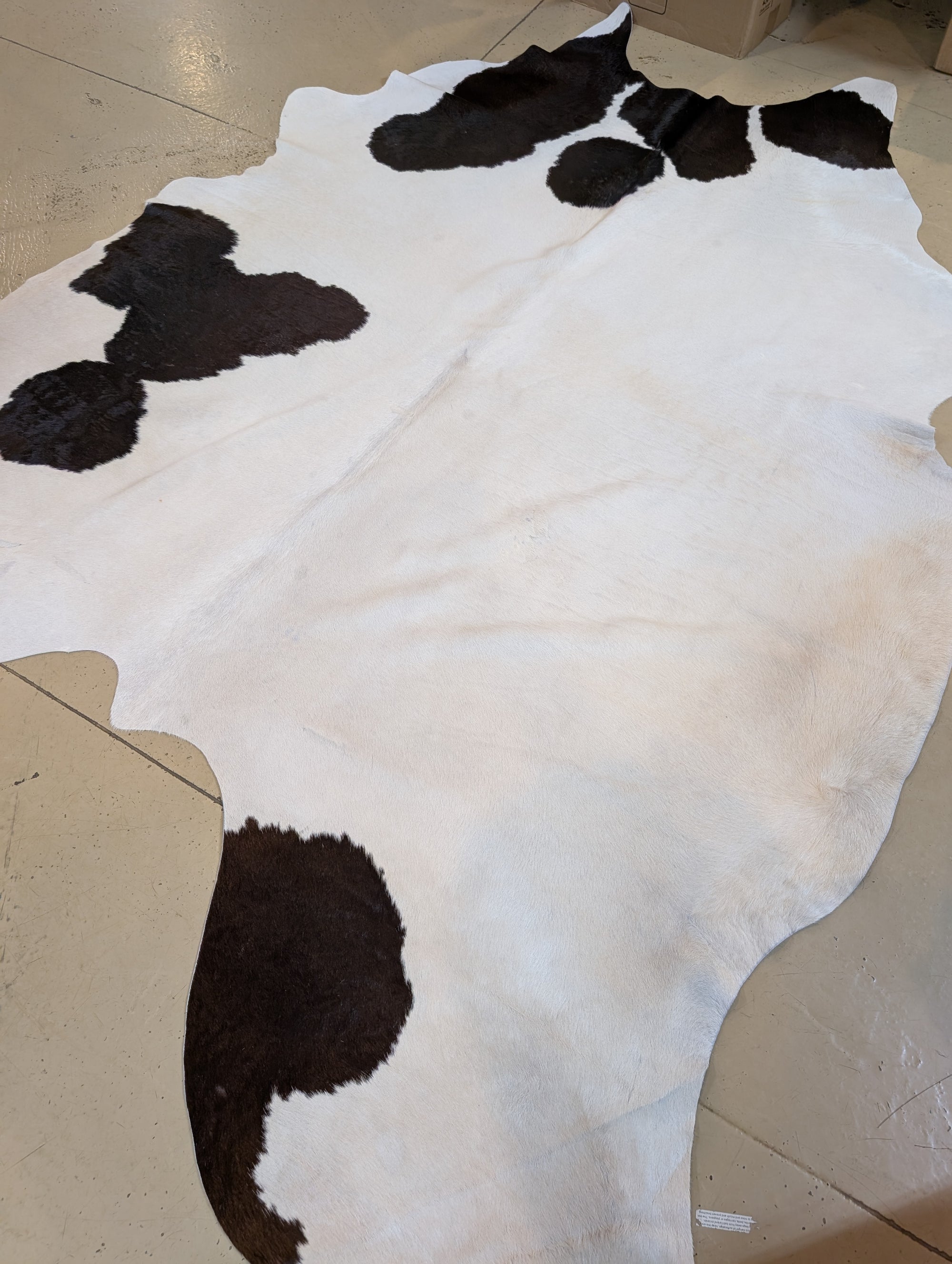 cowhide with natural blemishes, perfect for crafts and leatherwork