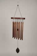 Wind chime hanging on gray background