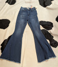 Blue jeans on a cowhide rug