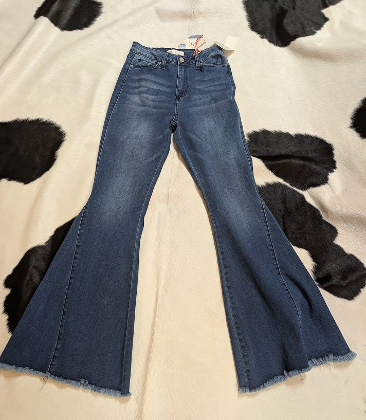 Blue jeans on a cowhide rug